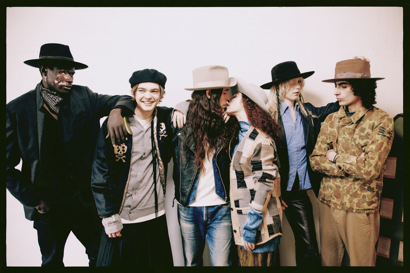 SUPERDUPER PARADE FW26/27 campaign — group wearing wide brim felt hats, caps and berets